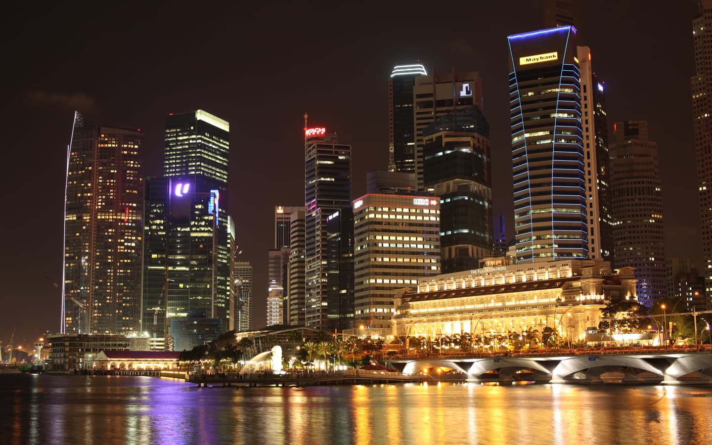 Singapore downtown lights reflected in Marina Bay, seen from the Esplanade
